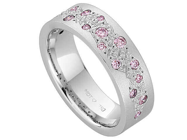 A white gold ring with pink sapphires.