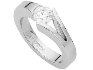 A white gold engagement ring with a round cut diamond.