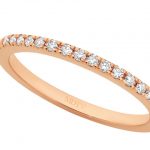 A Rose gold claw set wedding ring C571 with 18 x .01ct round diamonds.