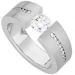 A sparkling white gold Tension Set Round Diamond Ring With Tapered Diamonds Band C845 engagement ring with a round diamond set in the center.