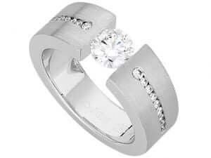 A sparkling white gold Tension Set Round Diamond Ring With Tapered Diamonds Band C845 engagement ring with a round diamond set in the center.