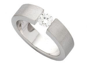 A Tension Set Round Brilliant Diamond Ring C364 with a round brilliant diamond set in the center.