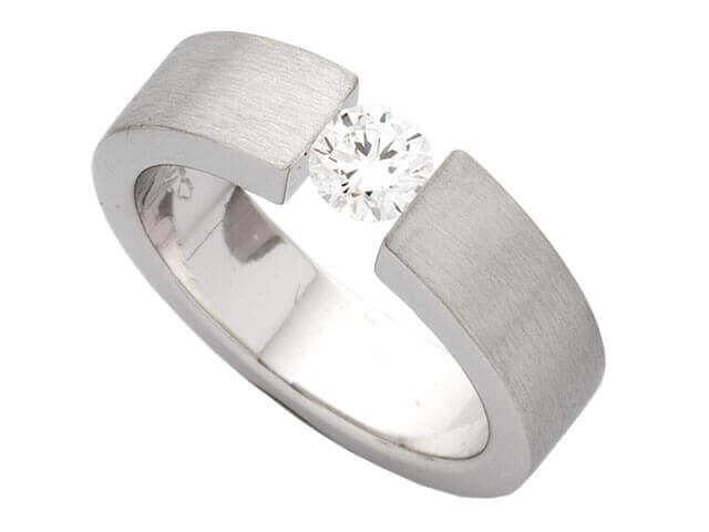 A Tension Set Round Brilliant Diamond Ring C364 with a round brilliant diamond set in the center.