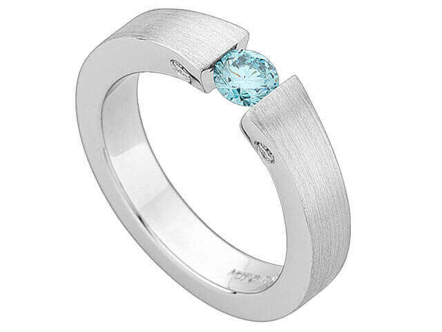 A white gold ring with a blue topaz stone, tension-set and identified as Tension Set Round Blue Diamond Ring C936.