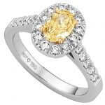 An Australian Fancy Intense Yellow Oval Shaped Halo Diamond Ring C1005.