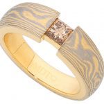 A Mokume Gane Ring With Princess Cut Champagne Diamond C1257 with a 18ct yellow gold and white gold band.