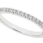 The White gold claw set diamond wedding ring C571 is a stunning diamond wedding ring crafted from white gold, featuring round diamonds.