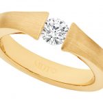 A Yellow gold tension set diamond ring C854.