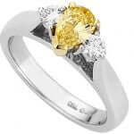 A Fancy Vivid Yellow Pear Shaped & Diamond Ring C990.
