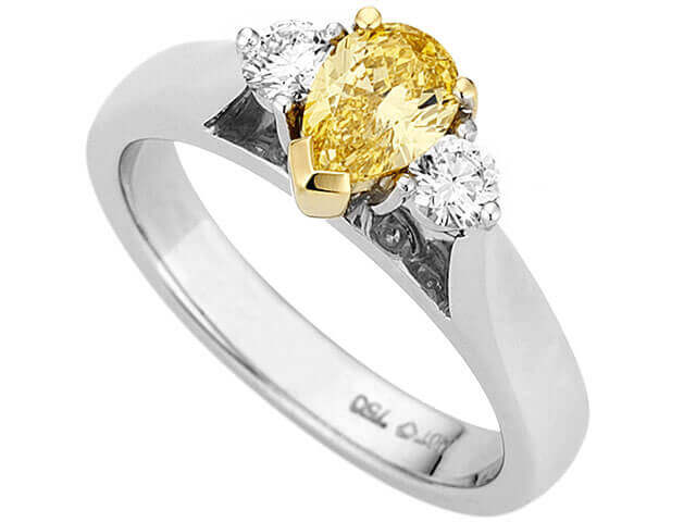 A Fancy Vivid Yellow Pear Shaped & Diamond Ring C990.