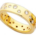 A Yellow Gold Random Set Diamond Flat Band C434 ring, featuring a flat band.