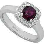 A breathtaking Halo Design Cushion shaped Ruby & Diamond Ring C1203 with a stunning cushion cut garnet stone, crafted in an exquisite halo design.