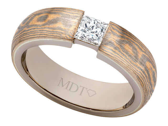 A Mokume Gane with Princess Cut Diamond C1257 men's wedding ring with a princess cut diamond and wood inlay.