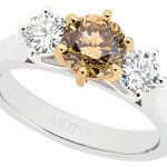 A Trilogy champagne diamond engagement ring C917 featuring three champagne diamonds set in white and yellow gold.