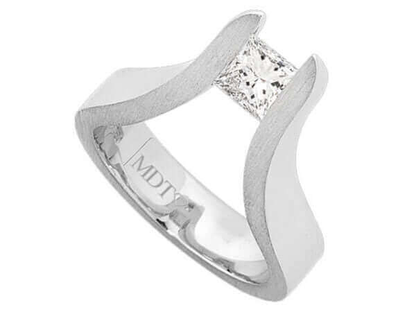 A white gold engagement ring with The Edge Tension Set Princess Cut Diamond Ring.