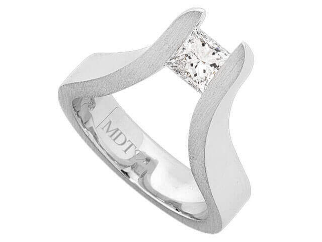 A white gold engagement ring with The Edge Tension Set Princess Cut Diamond Ring.