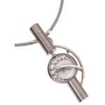 A white gold pendant with a diamond on it, adorned with the rEvolution2 -2008 jewellery Award design Finalist -C4031 design.