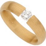The Tension Set Round Diamond Ring C015 features a Round Diamond in a yellow gold setting.