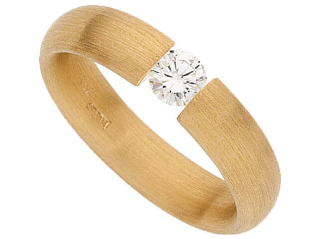The Tension Set Round Diamond Ring C015 features a Round Diamond in a yellow gold setting.