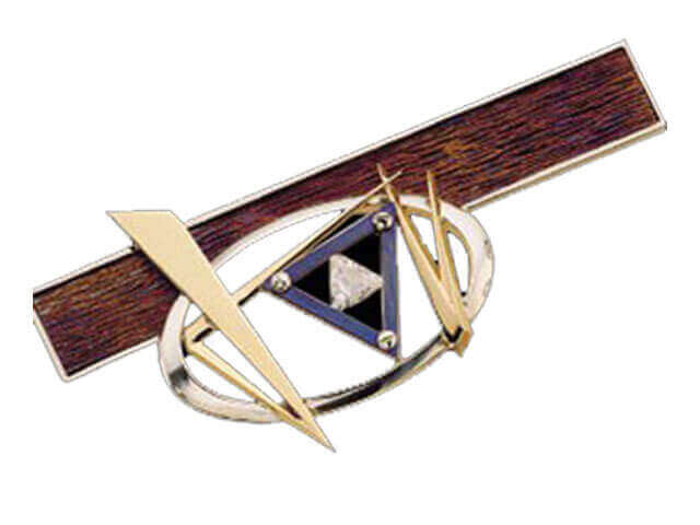 Meteor -1997 jewellery design award finalist – C4033, is a geometric abstract brooch featuring a wood-textured rectangular titanium bar, gold triangular elements, central trilliant cut diamond- that glistens like a meteor.