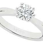 A 6 claw diamond solitaire engagement ring C1000 with a round diamond in the center, held by 6 claw prongs made of white gold.