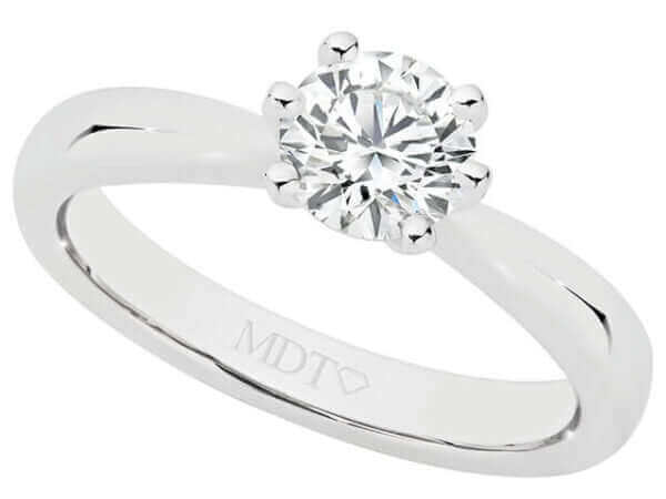 A 6 claw diamond solitaire engagement ring C1000 with a round diamond in the center, held by 6 claw prongs made of white gold.