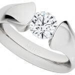 A Platinum tension set engagement ring C1026 crafted in platinum with a round cut diamond.