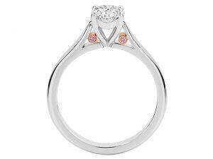 A Oval White and Pink diamond engagement ring C1065 adorned with bezel set pink diamonds from Argyle, featuring an elegant oval-shaped diamond in the centre