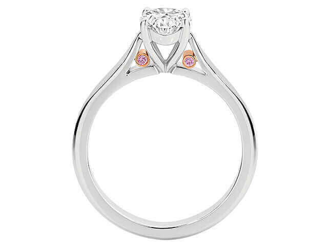 A Oval White and Pink diamond engagement ring C1065 adorned with bezel set pink diamonds from Argyle, featuring an elegant oval-shaped diamond in the centre