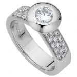 A White Gold Bezel Set Round Diamond Ring With Diamonds Band C637 with a round diamond in the center, creating a stunning White Gold Bezel Set Round Diamond Ring With Diamonds Band C637.