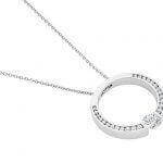 A white gold circle pendant with a diamond in the center.