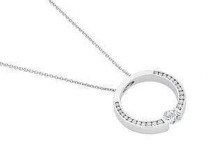 A white gold circle pendant with a diamond in the center.