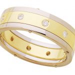 A Riveted Two Tone Diamond Band C204 wedding band with diamonds.