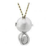 A pendant with a Soiree -2006 Award Winner and diamonds on a chain, perfect for a Soiree or as an elegant 2006 Award Winner accessory.