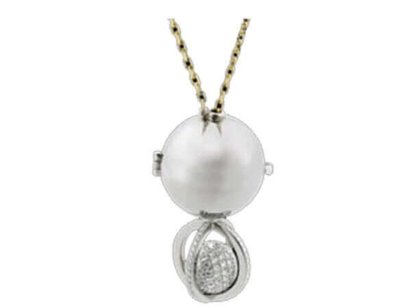 A pendant with a Soiree -2006 Award Winner and diamonds on a chain, perfect for a Soiree or as an elegant 2006 Award Winner accessory.