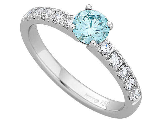 A Blue Round Diamond centre with white Diamonds claw set on the Band C666 18ct white gold
