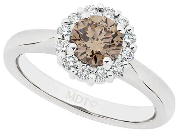 An round claw-set Claw set champagne diamond halo engagement ring in white gold.
