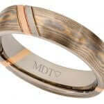 This 18ct rose and 18ct white gold Mokume Gane Wedding Ring C727 features a stunning rose gold inlay, making it a perfect choice for those seeking a unique Mokume Gane wedding ring.