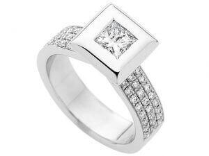 A stunning White Gold Bezel Set Princess Cut Diamond Ring With Diamonds Band C743 featuring a princess cut diamond set in elegant white gold.