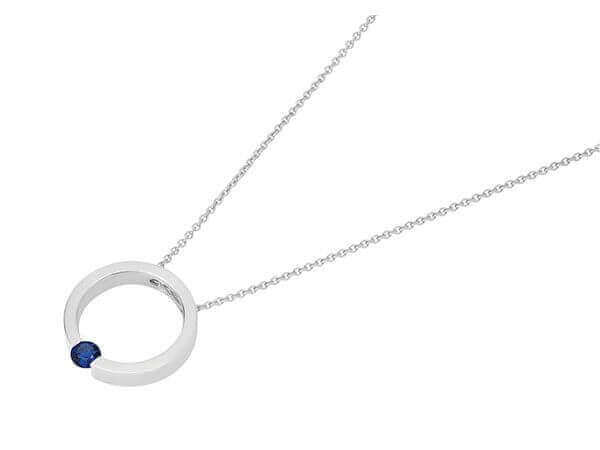 A Tension Set Blue Sapphire Necklace C1061, featuring a silver circle pendant adorned with a captivating blue sapphire stone (C1061).