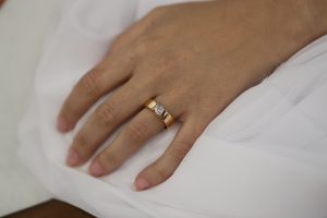 A woman's hand with a Rose Gold Tension Set Ring C364 beautifully Tension Set on it.