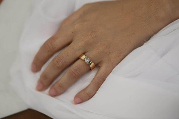 A woman's hand with a Rose Gold Tension Set Ring C364 beautifully Tension Set on it.