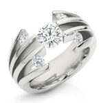 A Pente- 2017 Jewellery Award Winner white gold ring with a diamond in the center.