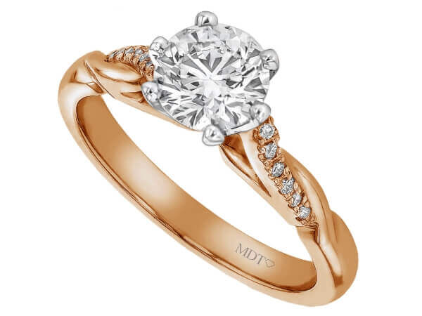 This elegant rose gold engagement ring features a round diamond nestled in the center, held securely by six claws.