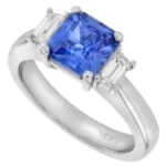 A Blue Sapphire Trilogy Engagement Ring C760 with diamonds.