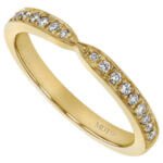 A Bow Ring Diamond Wedding Band in Yellow Gold C1056, adorned with diamonds.