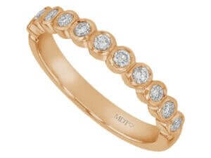 A stunning Bezel Set Round Diamond 18ct rose gold Wedding Band C468 featuring bezel-set round diamonds.