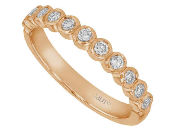 A stunning Bezel Set Round Diamond Wedding Band C468 featuring bezel-set round diamonds.