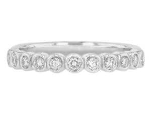 18ct white gold wedding band adorned with bezel-set round diamonds. Top view