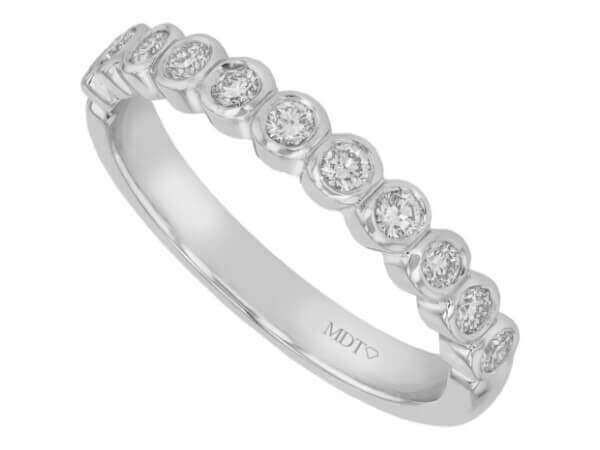 A stunning Bezel Set Round Diamond 18ct white gold Wedding Band C468 featuring bezel-set round diamonds.
